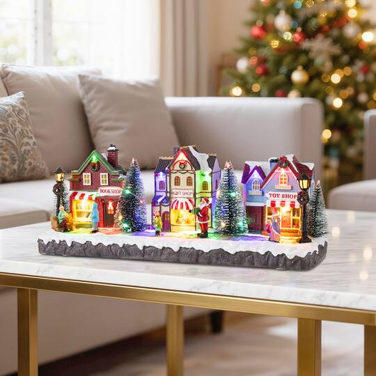 Glitzhome® 15.75" Lighted Christmas Resin Shop Avenue Musical Village with Timer